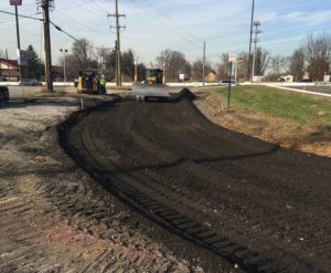 Bulldozer grading new Red Roof Inn driveway