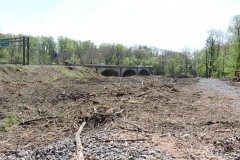 April 2021 - Workers clear vegetation for construction of an access road to the Neshaminy Creek, where a new U.S. 1 bridge will be constructed.