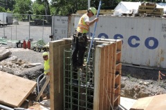 June 2022 - Workers construct a pedestal atop a foundation for a new sign structure along southbound U.S. 1 south of the Neshaminy Creek.